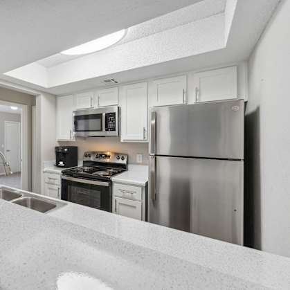 the preserve at ballantyne commons apartment kitchen with stainless steel appliances