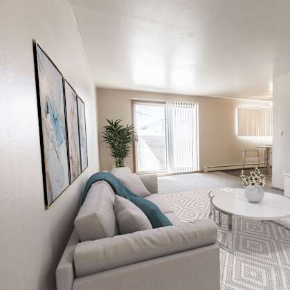 Bismarck, ND Stonefield Townhomes | a living room with a couch and a table and a television