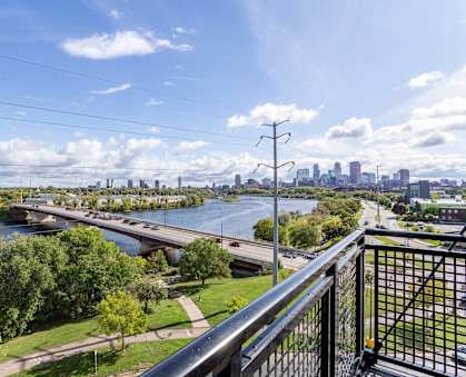 A Cityscape with a Bridge at Peregrine Apartments, Minneapolis