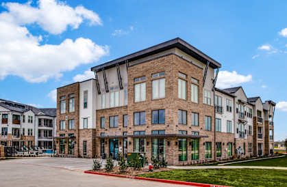 a picture of a building with a blue sky in the background