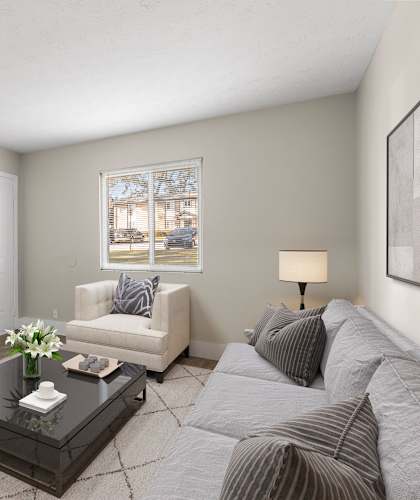 a living room with a couch and a coffee table at Ridgewood Apartments, Georgia