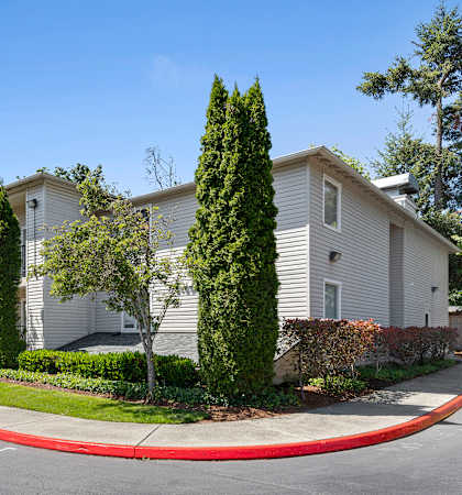 A row of houses with trees in front at Park Edmonds Apartment Homes, Edmonds, WA