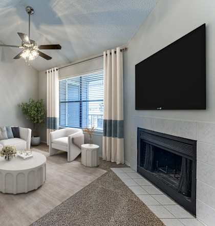 A living room with a fireplace and a television.