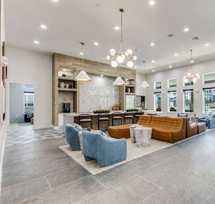 Club Room with Lounge Seating and Demo Kitchen at Cedar Heights Luxury Apartments in Austin, TX