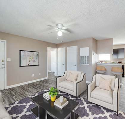 our living room and dining room are equipped with couches and chairs and a table