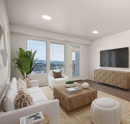 A modern living room with a flat screen TV and a large window.