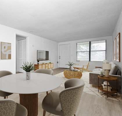 a living room and dining room with a table and chairs