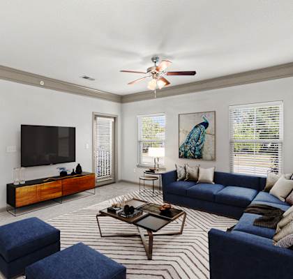 a living room filled with furniture and a flat screen tv at Stonepost Crossing Apartments, Overland Park, Kansas