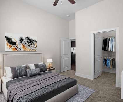 A bedroom with a large bed and a painting on the wall at West 39th Street Apartments, Kansas City, 64111