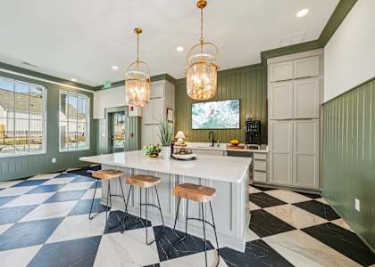 Clubhouse kitchen with island and coffee station at Turnberry Park in Gardendale, AL