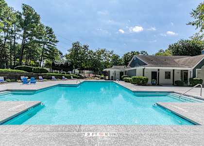 a large swimming pool with a house in the background at The Atlantic Newtown, Alpharetta, 30022