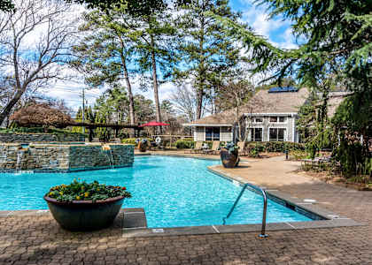 a swimming pool with a house in the background at The Atlantic Vinings, Georgia
