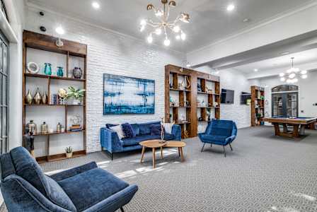 resident clubhouse with an internet café and cozy fireplace