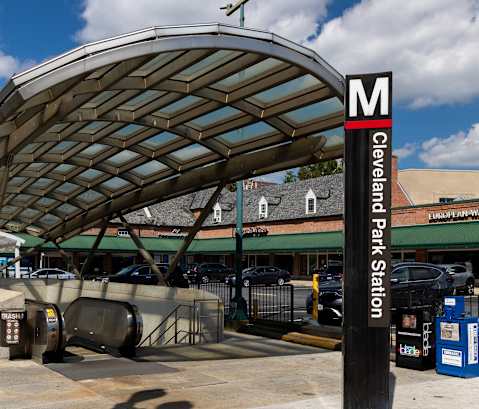 a gas station with a canopy over a parking lot