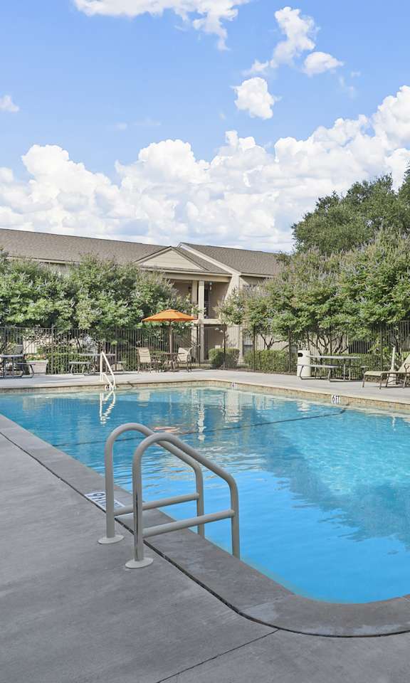 the swimming pool at the falls at rolland park apartments  at Parks on the Green, Texas, 76504