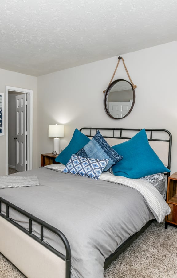 a bedroom with a bed and a bathroom with a toilet at The Atlantic Newtown, Alpharetta, 30022