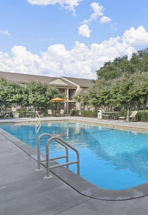 the swimming pool at the falls at rolland park apartments  at Parks on the Green, Texas, 76504