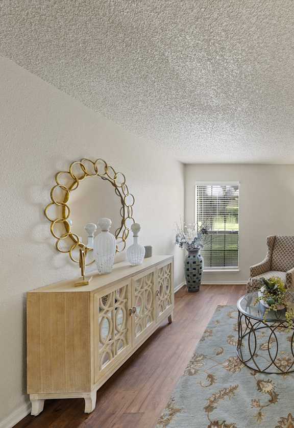 a living room with a couch and a table  at Parks on the Green, Texas, 76504