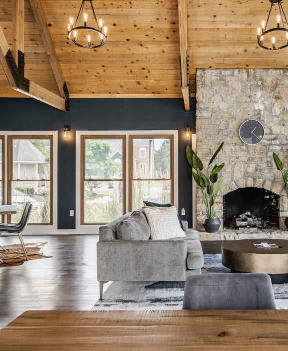 a living room with a couch and a kitchen with a table and chairs