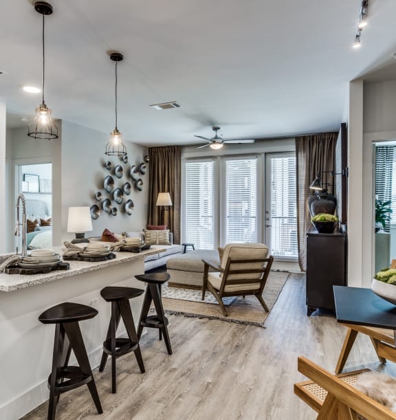Model kitchen and den at Station at Old Town, Lewisville