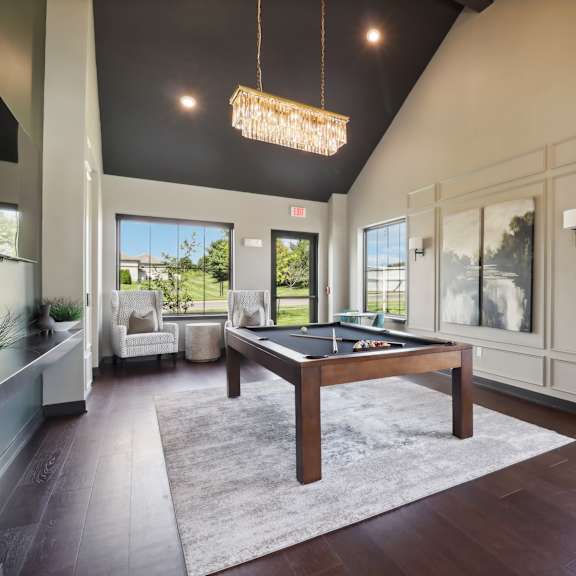 a pool table in a living room at The Depot in Raymore, MO 64083
