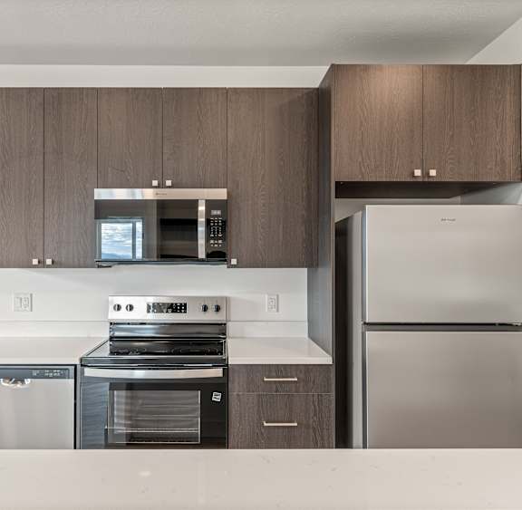 a washer and dryer in a room with a white wall