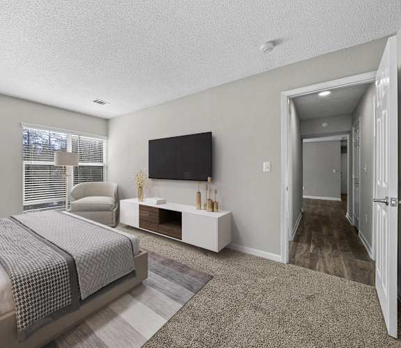 a spacious bedroom with a large bed and a tv