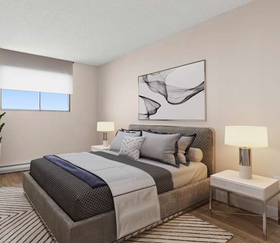 A bedroom with a large bed and a television on the wall.