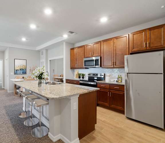 a kitchen with an island and stools