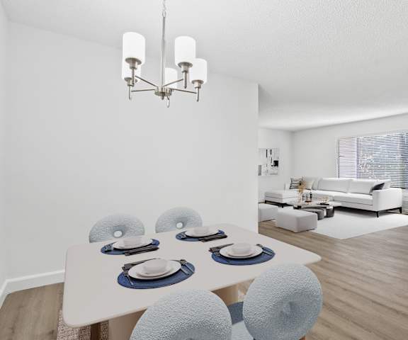 a dining room with a table and chairs