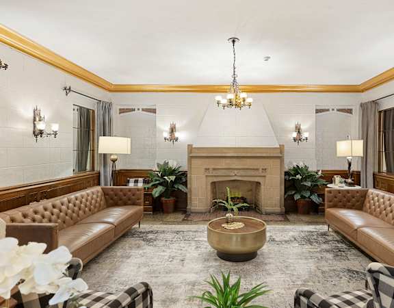 a living room filled with furniture and a fire place