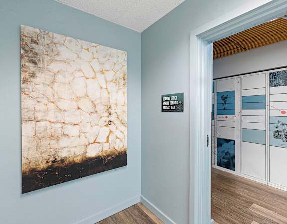 a photograph of a hallway with a painting on the wall at Excalibur, WA 98004