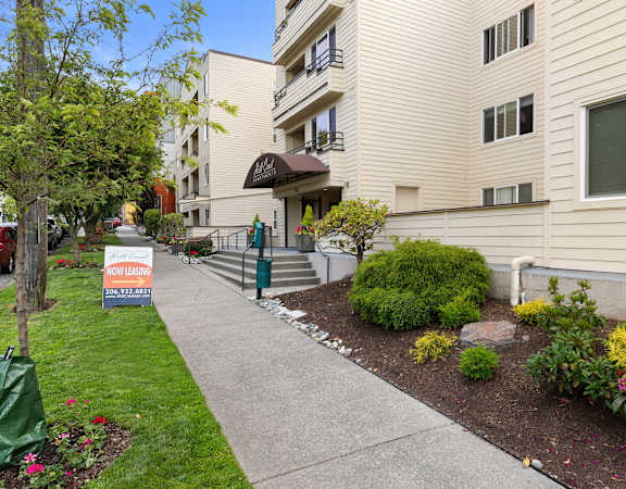 a sign in front of an apartment building at Hill Crest Apartment Homes, Seattle, WA