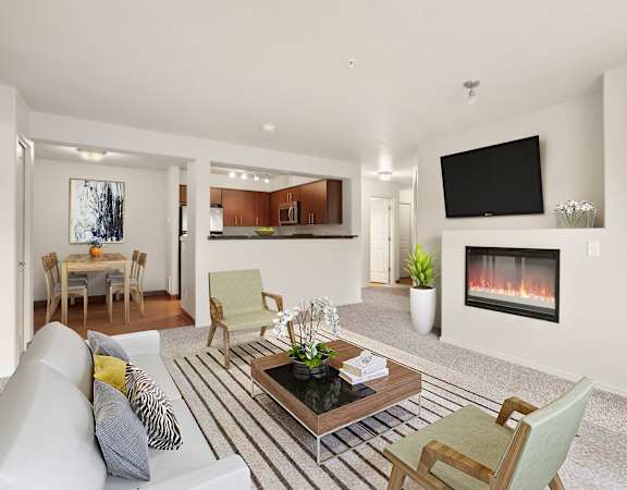 A modern living room with a fireplace and a flat screen TV.