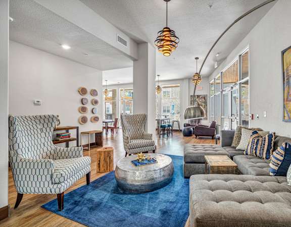 a living room filled with furniture and a large window at Urban Crest Apartments, San Antonio, TX, 78209