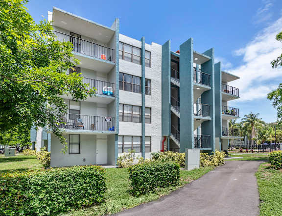 an image of an apartment complex with trees in the background  at Club at Emerald Waters, Florida, 33021