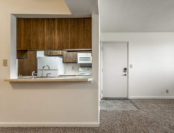 a view of a kitchen and a door in a house at Bay Pointe Apartments in IN 47909