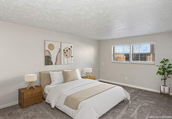 Bedroom with window and art on the wall