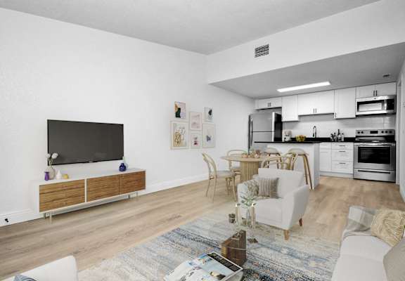 a living room with a couch and a table and a television