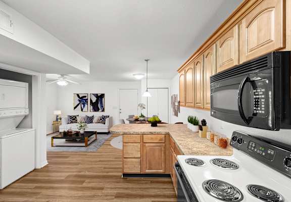 a kitchen and living room in a 555 waverly unit