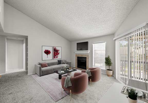 a living room with a couch and a chair and a fireplace
