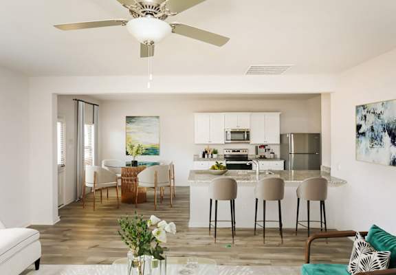 a living room and kitchen with a ceiling fan