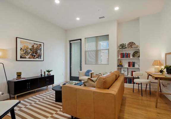 a living room with a couch and a table
