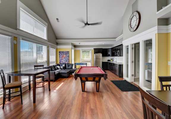 a large living room with a pool table and a kitchen in the background at BrookStone Village, Cincinnati 45209