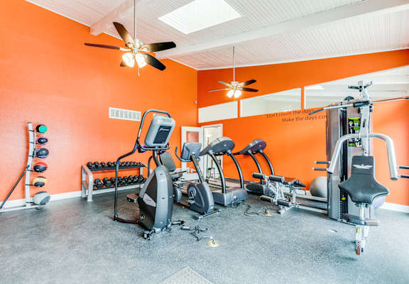 the gym has plenty of exercise equipment for your workouts at Falls on Clearwood Apartments, Richardson, TX, Texas