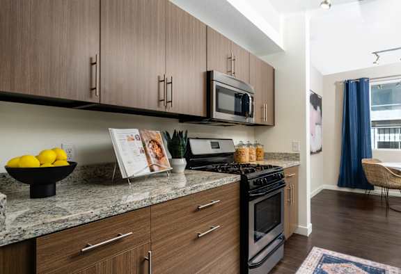 A kitchen with a bowl of lemons on the counter. at Miro at the Parc Apartments, Henderson , NV, 89074