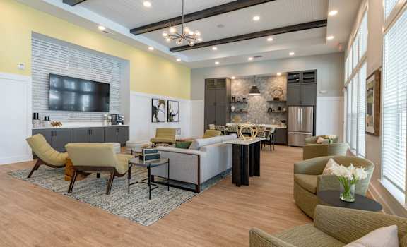 a living room with couches and chairs and a table