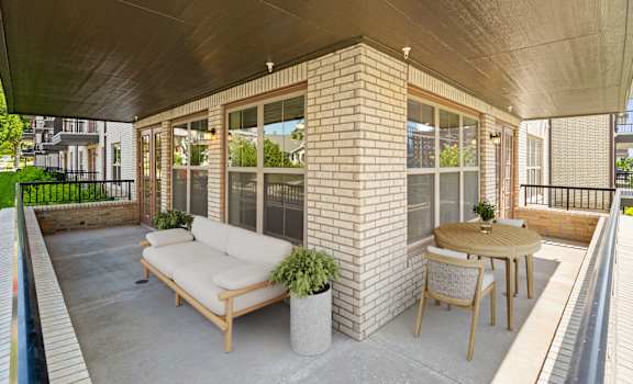 our apartments showcase a beautiful screened in porch at The Dorset, Kansas City, 64112