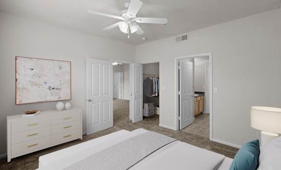 A white bedroom with a bed, dresser, and a painting on the wall.