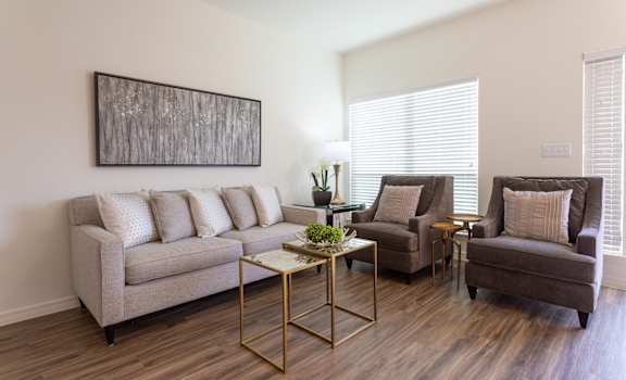 a living room with a couch chair and coffee table